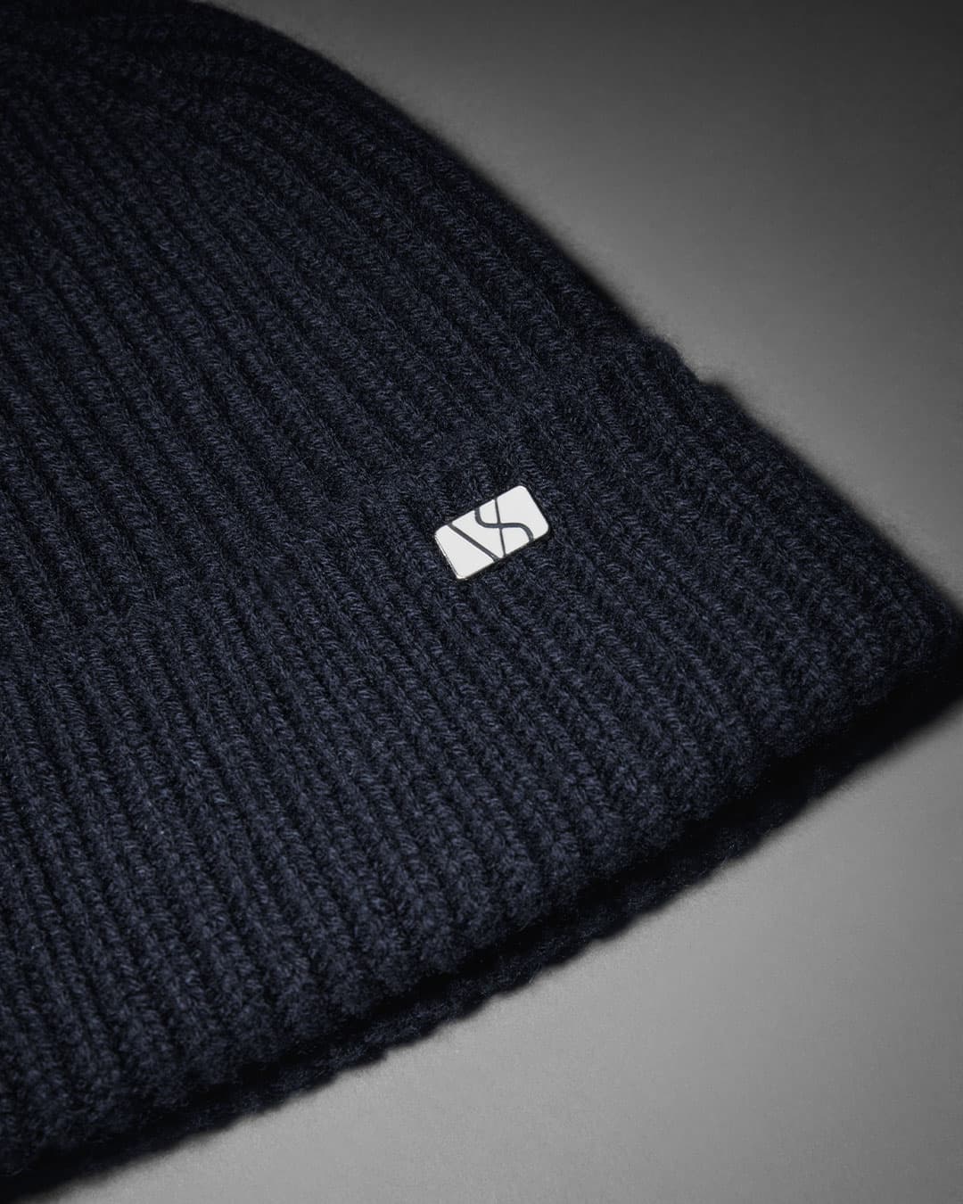 Detailed view of navy cashmere merino wool blend beanie from varsity headwear