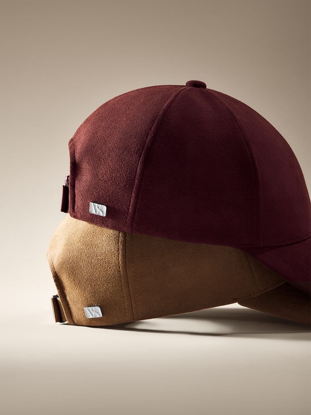 Close side view of burgundy and brown alcantara cap from Varsity Headwear autumn winter 25 collection