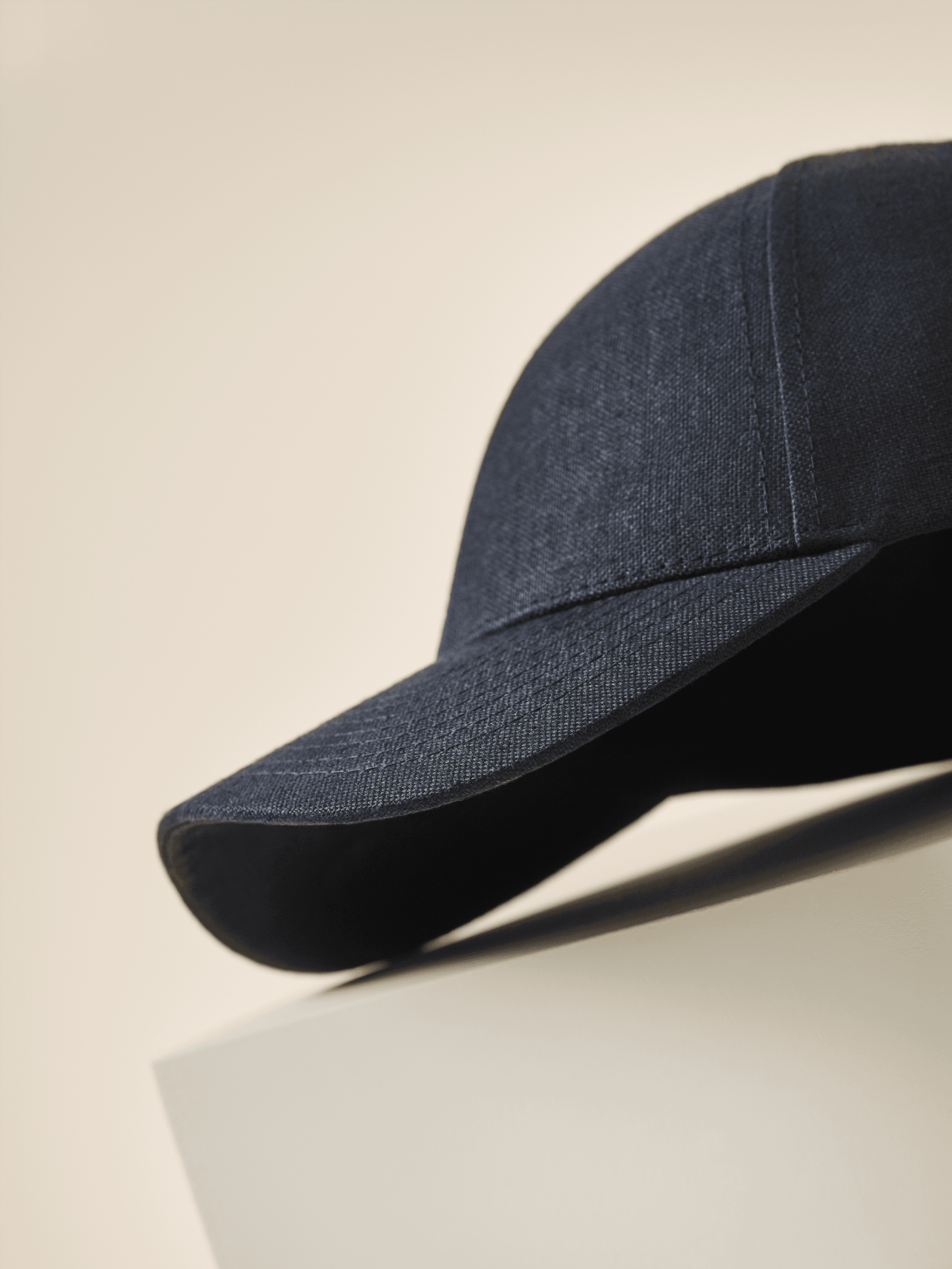 side view of dark navy linen cap