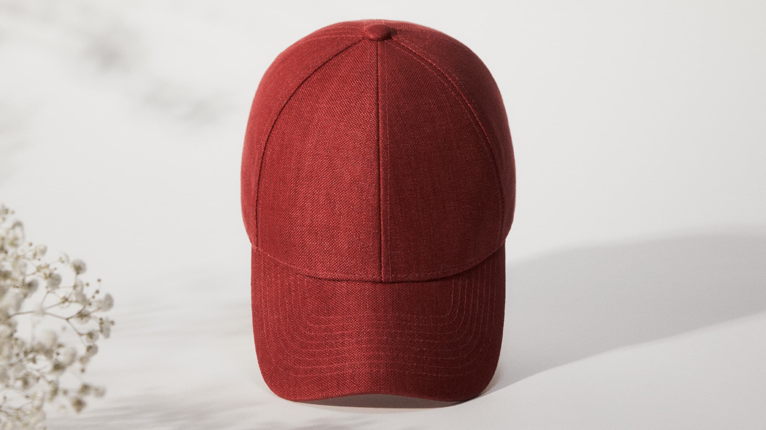Front view of a an legacy structured Amaranth Red linen cap from Varsity Headwear
