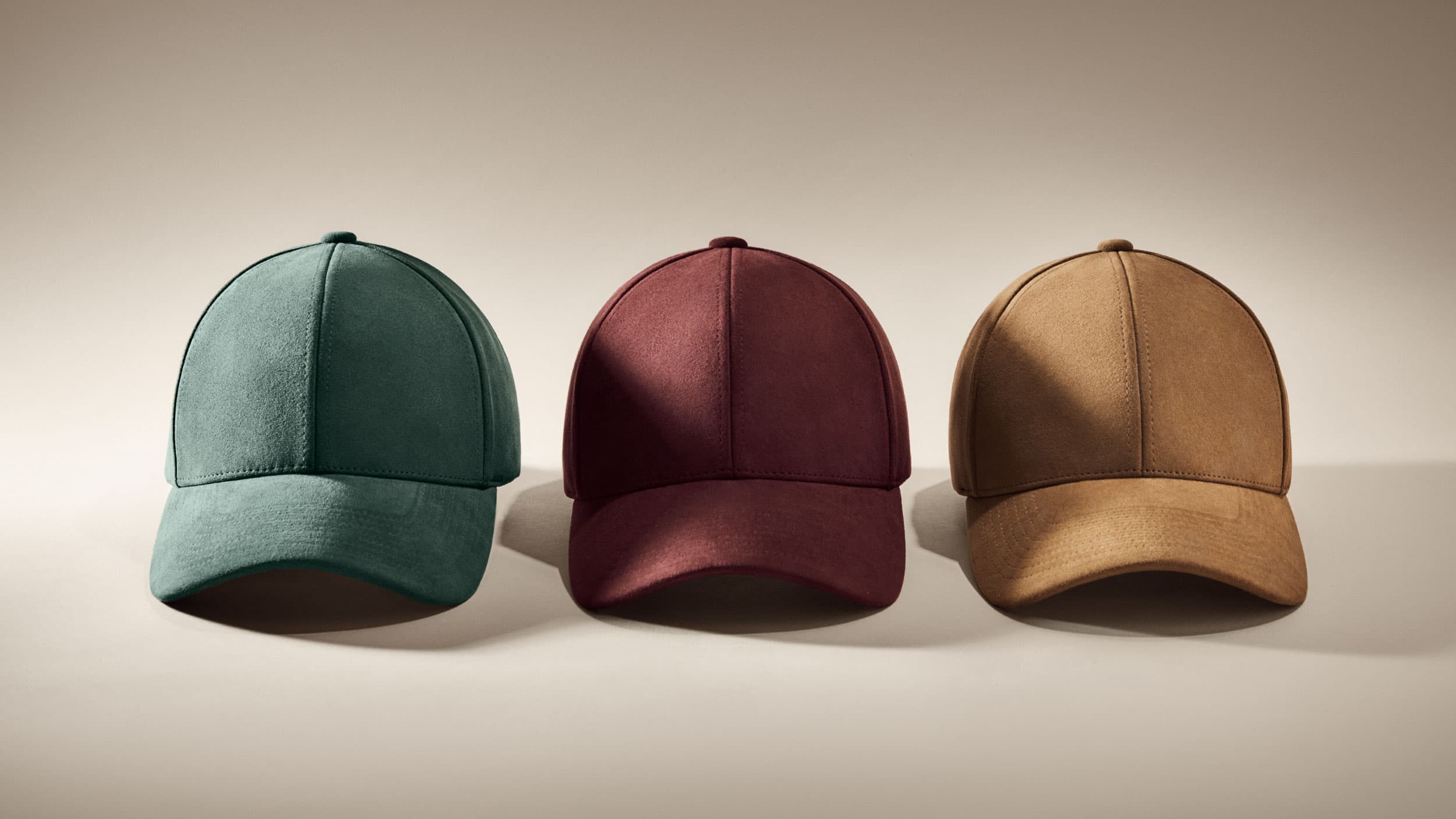 Front view of alcantara caps from varsity headwear in green, burgundy and brown