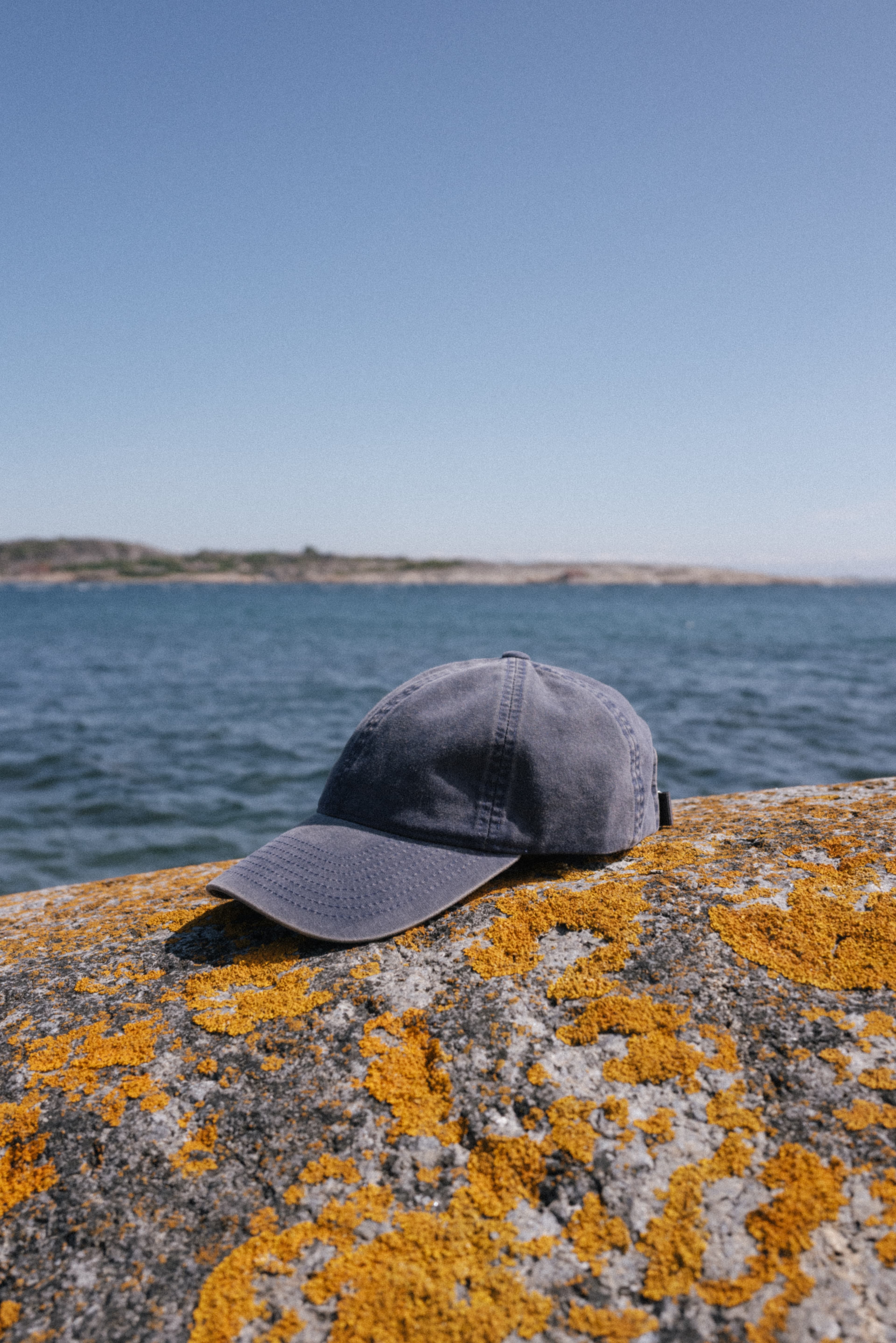 Navy washed cotton cap in Norwegian summer landscape
