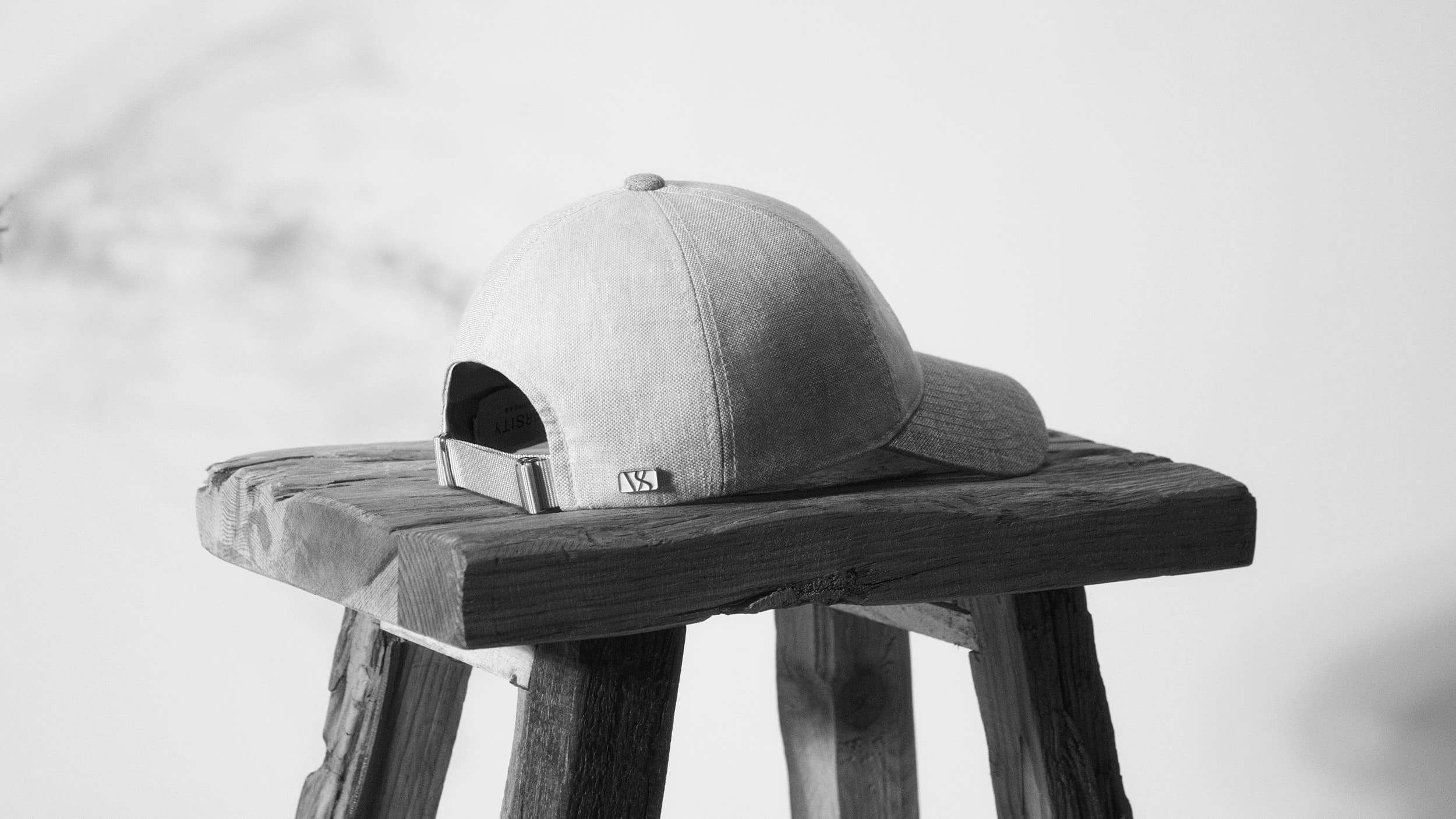 Back view of linen cap from varsity headwear in black and white